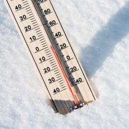 thermometer sticking into the snow